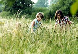 Two children being naturally exposed to grass pollen